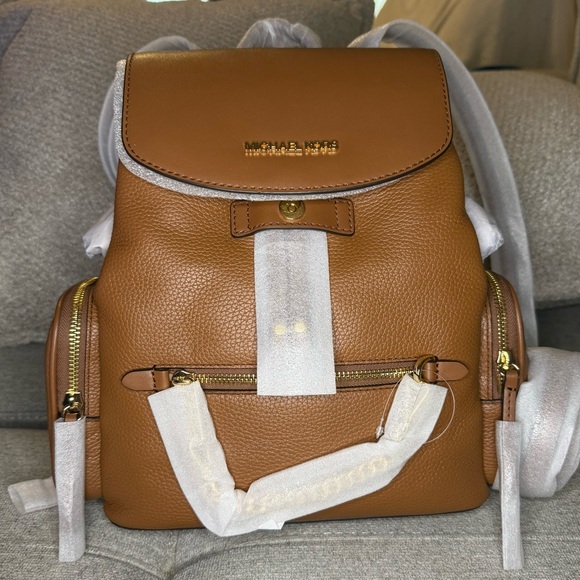 Michael Kors Handbags - Michael Kors jet Set Brown Leather Backpack